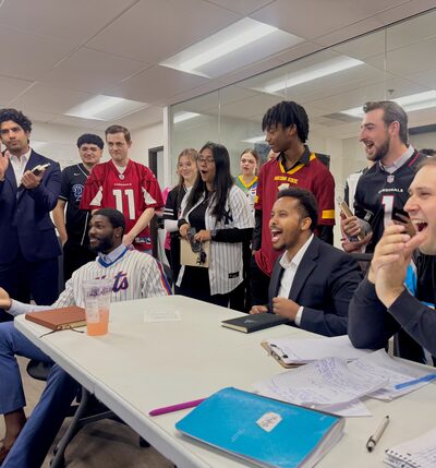 Team members wearing sports jerseys during a team-building day